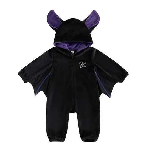 The Lunaby Bat Suit seen from the front: black velvet baby romper with a purple-lined hood, stand-up bat ears, scalloped wing sleeves, full-length front zip and Bat script embroidery