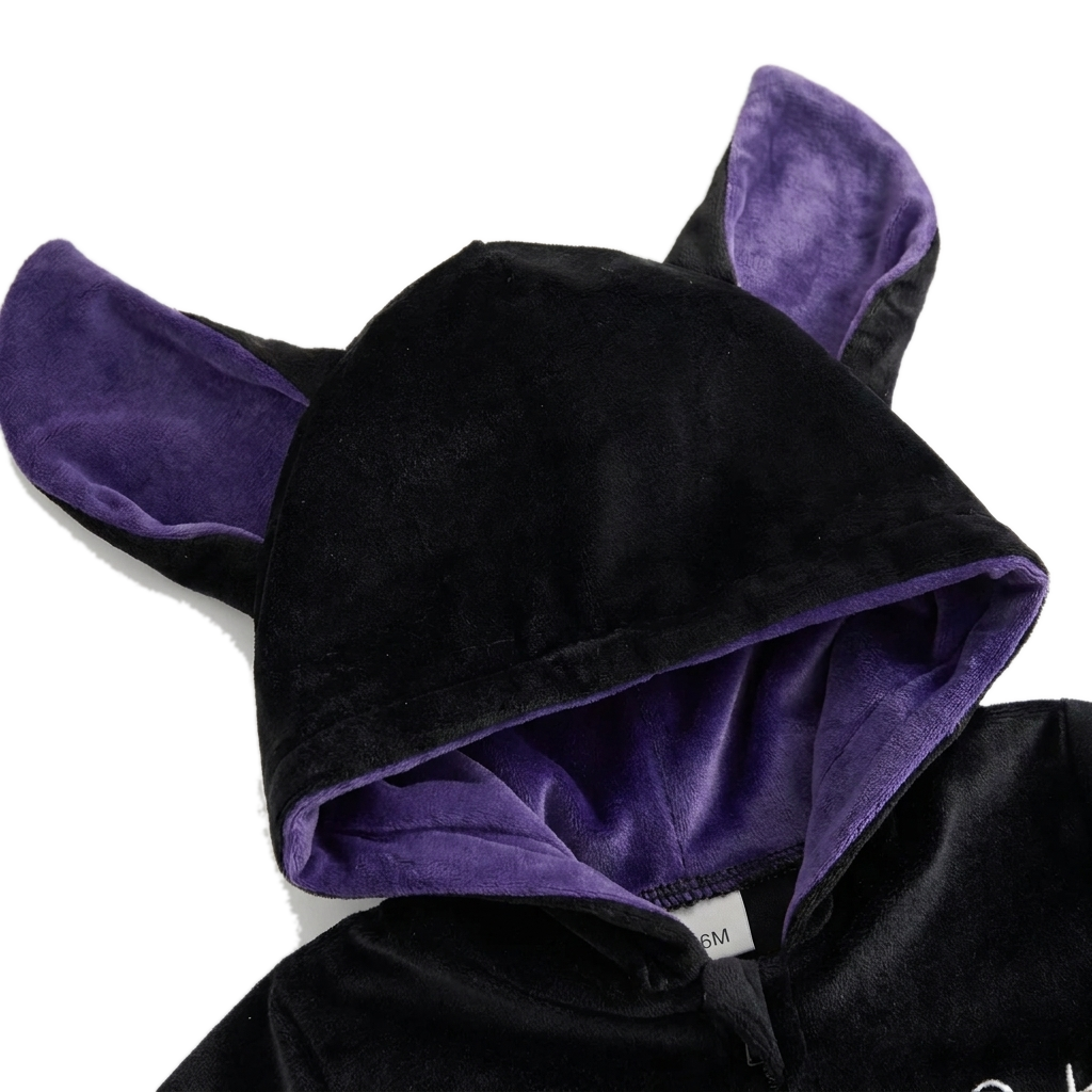 Close-up of the hood: soft purple velvet lining inside the ears and around the face opening
